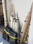 Bundles of interior materials Six small rolls of vinyl flooring; a few bundles of chopped up architraves, two bundles of protective floor sheets. NW10 - removed for £104