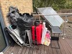 Various random items Random items including two foldable sunbeds, one suitcase (empty), some plastic parts, one small side table, on bin bag with a big plastic cover, one inflatable animal, a kid toy WC1X - removed for £104