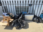 12 bags of rubbish, 2 box 1 su 2 boxes of rubbish 13 bags of rubbish 1 suitcase W11 - removed for £94