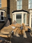 mostly cardboard a lot of cardboard from our renovation and couple of wooden pallets. too big for our bins and no car to take to the tip. SE4 - removed for £117