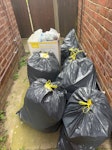 9 bin bags and 1 large box Around 9 black bags plus 1 large box of mixed household waste. Mixed rubbish including nappies, plastic, cardboard, food, food packaging and general household waste. Everything is mixed together but fully bagged/contained and easy to access outside the property. Bins were not collected. DE5 - removed for £59