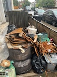 wood and other material mostly wood, bags of material from sanding timber floors, and a few other metal and plastic items E5 - removed for £194
