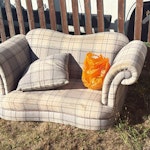 Small 2-seater sofa Small 2-seater sofa in beige/grey tartan check fabric, for waste disposal - it has staining (a charity reuse collection refused it for staining), so disposal not resale. Legs already detached and in the orange bag on the seat - bag included, sofa already disassembled for easy carry. Large scatter cushion in photos included. Outside at the front boundary, visible and accessible - nobody needs to be home. Anytime, sooner the better. IG10 - removed for £71