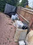 Random garden clearout Table tennis table, swinging egg chair and frame, old patio slabs, left over bathroom tiles, left over floor tiles, plastic boxes, wooden planters x2, general rubbish. BN6 - removed for £143
