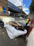 timber, wood sheets off cuts of timber, and other waste items including broken microwave and timber sheets. SE1 - removed for £257