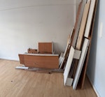 Removal of 3 x-large wardrobes 3 extra large wardrobes ( 1 w/Murphy style bed) including single mattress. 

Additional material for removal: 
- kitchen cabinets (5) and worktop 
- wooden-ish flooring (35 square meters worth) 
- hob and oven W3 - removed for £257