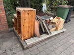 Pet hutch (mostly wood, mesh) Old outdoor rabbit hutch (wood, metal mesh, 4 ground spikes), wooden unit, wood wine boxes. Largest piece is base for hutch (everything sitting on this) 1.2m x 1.9m. All just inside the drive gates as shown. KT10 - removed for £104