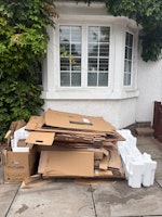 Pile of carton boxes collected by Bincredible Waste Solutions
