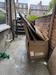 Large Pile of Cardboard A large pile of cardboard! Some may be reusable, but it has been outdoors for a while. Also, a white plastic container that could be repurposed. SE14 - removed for £88
