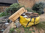 Hippo Skip bag of wood + other Hippo Skip bag full of just Wood
Three other small/medium boxes of Wood two concrete blocks some logs
20 long thin metal poles from a gazebo
6 medium sized logs
Wood TV cabinet
1 plastic box full of plastic plant pots
One small bag of soil waste CV35 - removed for £453