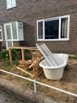 Acrylic bathtub and timber Acrylic bathtub (not ceramic), timber used for delivery/support of new bathtub, dismantled old wooden crib/cot, and one metal curtain rail. All items are outside at the front of the property with easy access for collection. SE26 - removed for £94