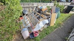 old carpet and miscellaneous A pile of old carpet, an empty wheelie bin, a few pallets, wood stuff, a few plastic items, a small box with miscellaneous items. TW8 - removed for £156