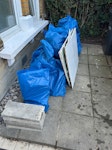 Bathroom and garden work waste Around 35 rubble sacks containing waste from bathroom and garden work - tiles, plasterboard, tiles attached to plasterboard, soil, rubble. Also 2 larger sheets of tiles attached to plasterboard, and one small one, plus 5 paving slabs. All piled up in front garden with access to road N8 - removed for £156