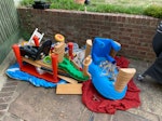 old toys and wood from shed Some old large toys all light plastic made. A tricycle and lots of old odds and ends of wood and pipe. SE12 - removed for £71