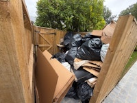 Bags of rubbish and cardboard collected by Perkins&Sons clearance &removals