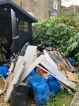 Two piles of waste Pile of junk, roughly sorted by material. In back garden with side access and parking out front N16 - removed for £257
