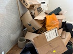 empty boxes, small safe, pots lots of empty cardboard boxes, a small bedroom safe, a couple of plant pots (reusable), a black hold-all bag with wheels (reusable), a large framed picture of Anne of Green gables book (perfect condition), and a couple of bags of rubbish N1 - removed for £94