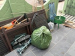 assorted garden waste old garden table, camping chairs, greenhouse parts, stone offcuts, bag of general waste, other bric a brac N8 - removed for £94