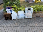 Small pile of junk Broken luggage case, plastic tubs, small nest of coffee tables and a robot BR6 - removed for £71