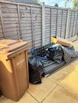 Brown bin, swing seat, binbags dismantled swing seat, brown bin contents, large box with polystyrene, 2 full bin bags of household rubbish. ST16 - removed for £141