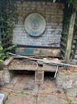 mixed light waste Rear garden clearance. 5 light bin bags (old bin, plastic bits, pot), bag of slatted wood, 1.2m green wooden planter, 2-3 black wooden boards, ~20 ceramic tiles, 3-4 copper pipes (2m), metal rods, white plastic trunking/pipe, bamboo canes, pot saucer. Mostly light. Approx small van load. Wall plaque and brick bench stay. NW1 - removed for £83