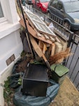 furniture, garden waste / soil broken bed frame, pallet, broken lamp, cardboard, garden waste includes some soil, microwave, old window, broken lamp BS5 - removed for £156