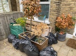 Garden and household waste includes x2 wooden pallets, bags of household rubbish and garden waste/old plants SW19 - removed for £94