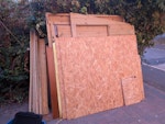 Dismantled shed on driveway This shed was inside a garage used as makeshift music room. It had foam panels all over the walls and ceiling and still has a few left stuck (as hard to remove). It has been dismantled carefully  but the door has now been taken. Rest of the shed is fairly intact, though screws removed and packed flat. Largest panel is around 200cm x 130cm. IG8 - removed for £117