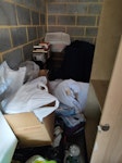 A garage full of junk As per photo large leather arm chair wardrobe and boos electrical goods and so on SE14 - removed for £400