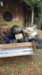 6 bags, cardboard, 2 lights cardboard, polystyrene packing, 2 lights (broken), plastic laundry basket, bit of broken trellis, clock, W4 - removed for £94