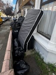 12 black bin bags, mattress, 12Bin bags of rubbish, 1 good condition luggage and 1 damaged mattress N9 - removed for £88