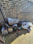 Clean out of shed old inflatable hot tub, metal poles, old lawn mower, rubbish SW2 - removed for £94