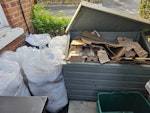 +3 big garbage bags black bin He have alot of cardboard (inside the box in the picture, a few big bags of bubble wrap and stretch film (as seen in picture, some shelves And 3 70lt black bags (two of them in the black bin, on inside the property. And we want the blue bin (full of cardboard emptying. SW19 - removed for £130