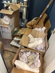 Cardboard boxes and packing Pile of flattened cardboard boxes. 6 boxes filled with paper packing material. 2-3 black bin bags of styrofoam packing materials. W4 - removed for £71