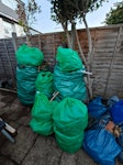 Garden, wood, felt, other We have a collection of mixed size garden waste bags, rubble bags with rubble and old wood,  felt from old shed roof, old osb chipboard, large wardobe (disassembled),  logs from cut down tree,  astroturf, carpet and underlay, carpet grippers W7 - removed for £257