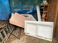 Small sofa and dismantled bed collected by Best waste clearance