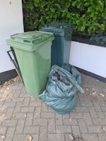 Bag of rubble and wheelie bins collected by Best waste clearance